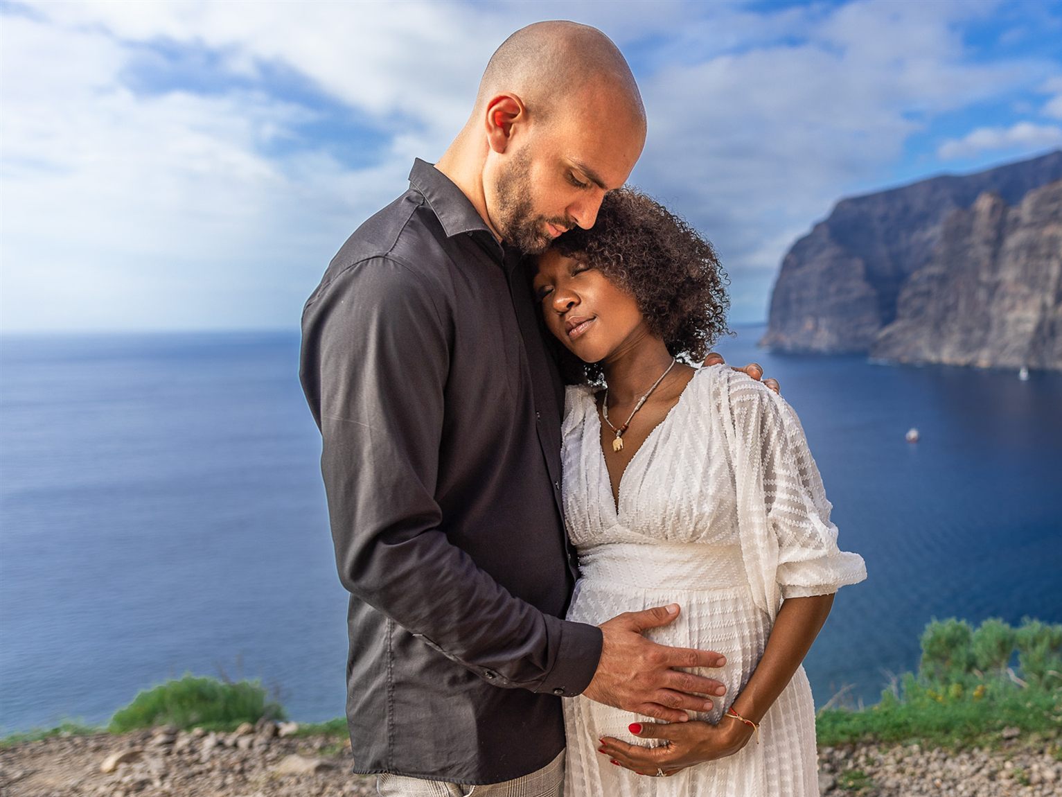 Couple portrait at Los Gigantes, blue sky and rocks