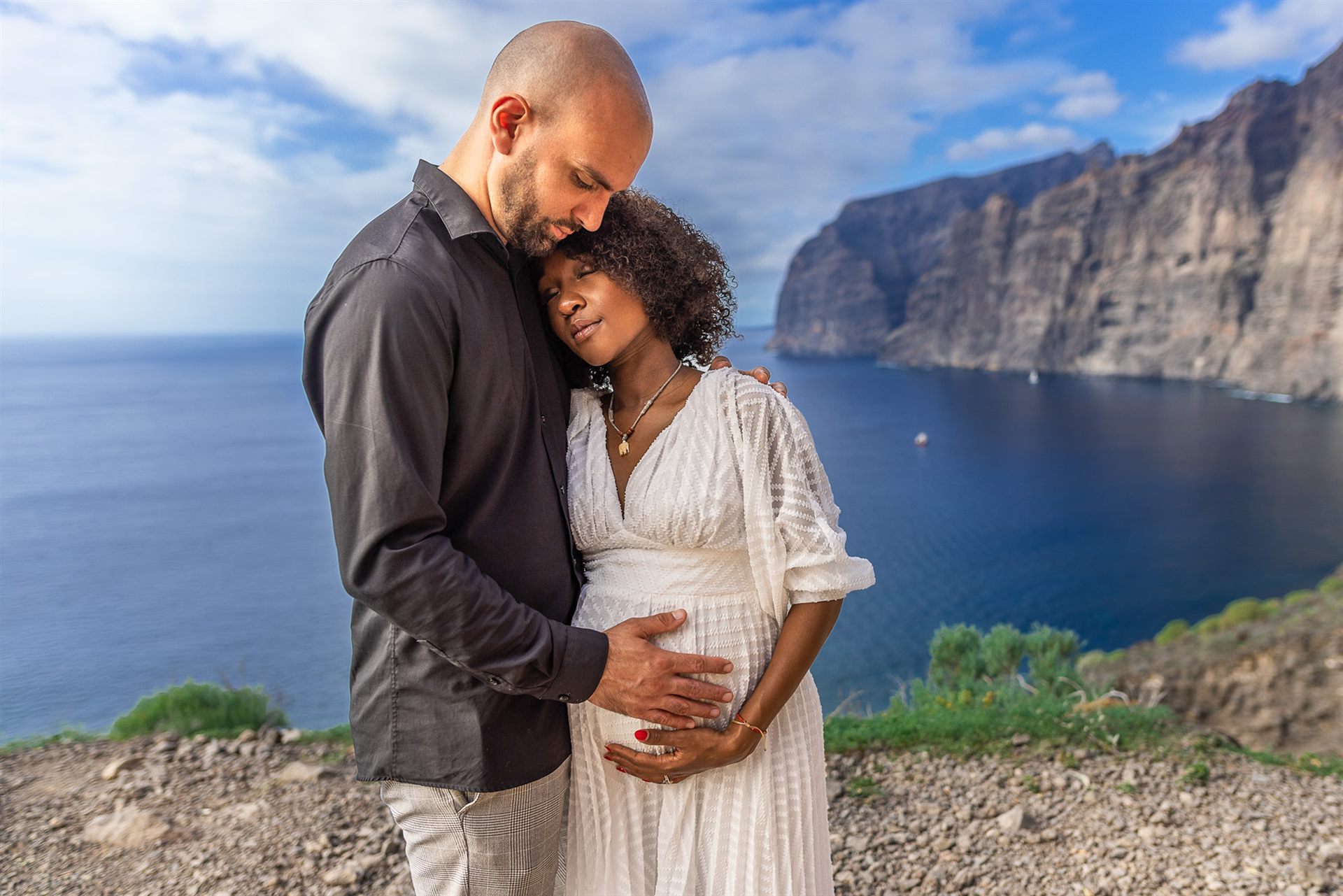 Couple portrait at Los Gigantes, blue sky and rocks