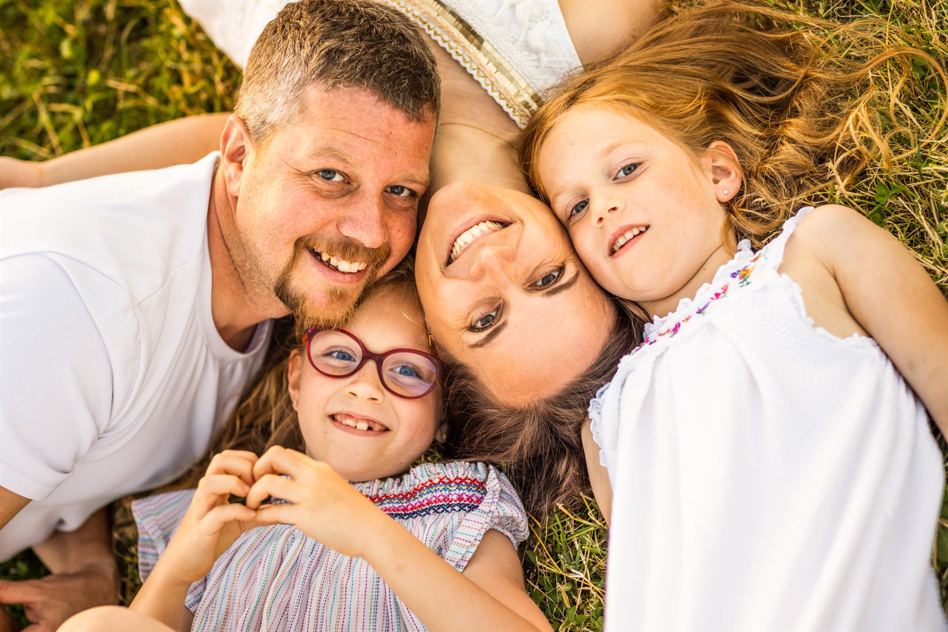 Family playing in the green field by Playa Fañabé, Costa Adeje