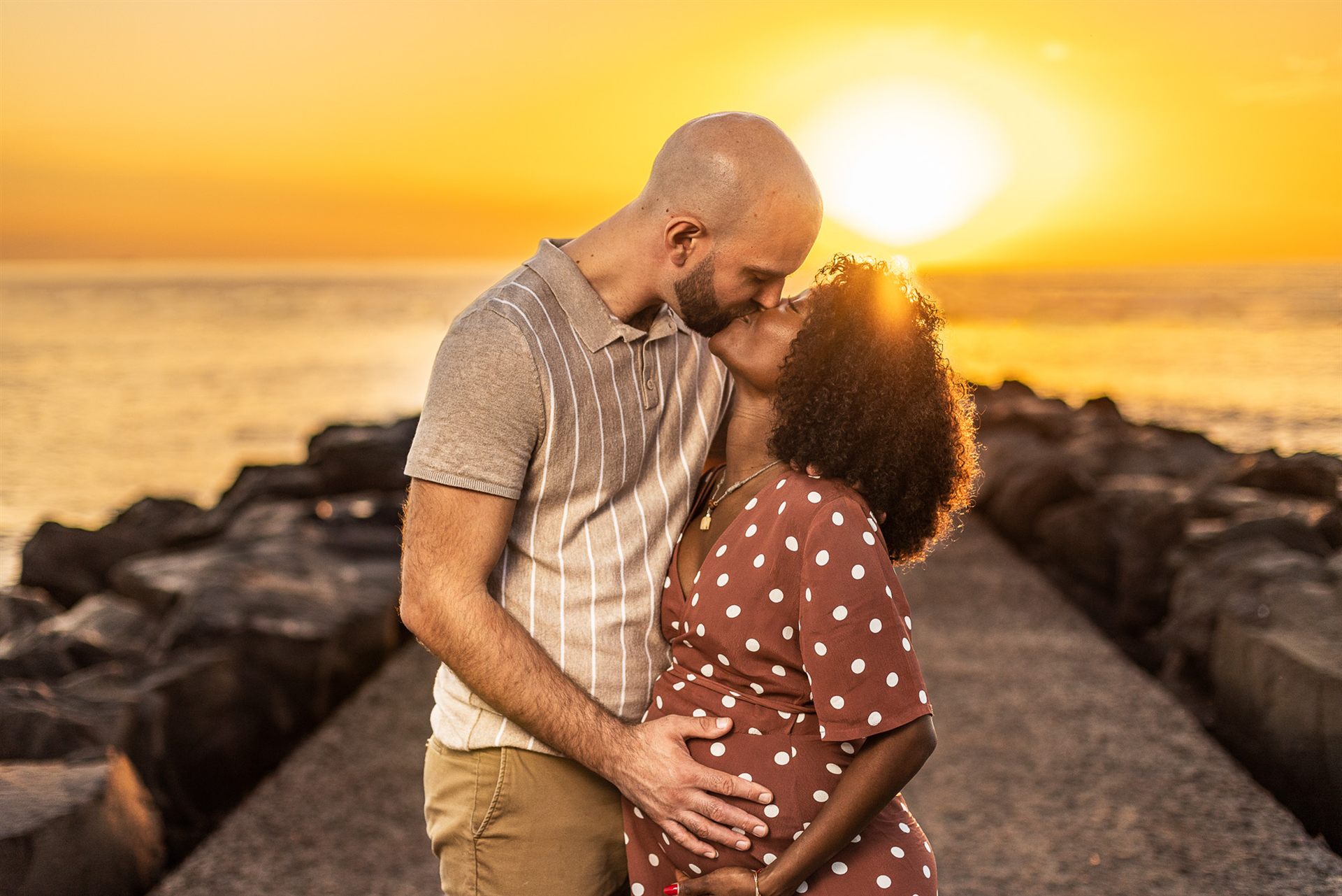 Maternity couple portrait at golden sunset on Playa del Duque