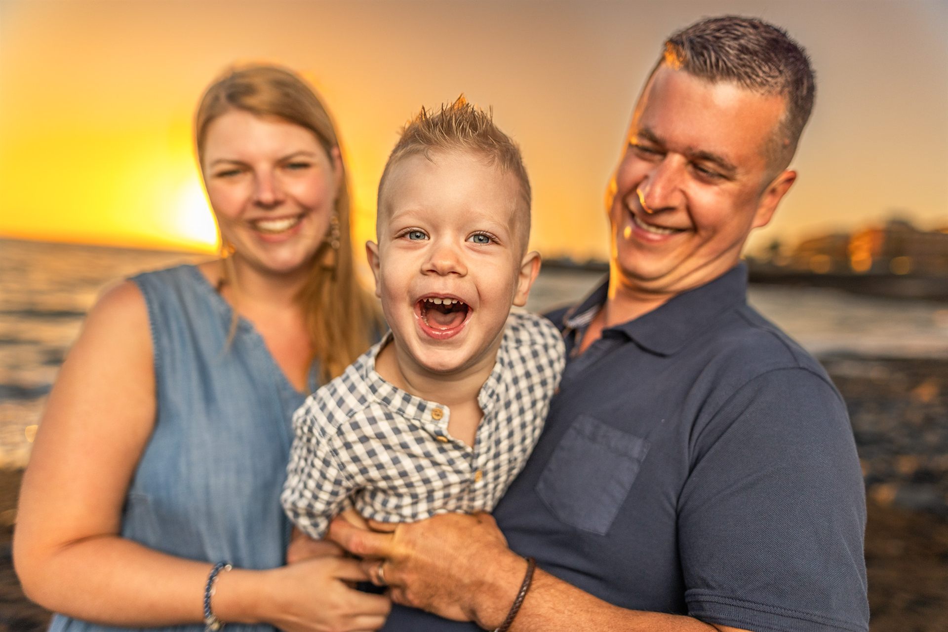 Family enjoying golden sunset at Playa de la Enramada, Costa Adeje