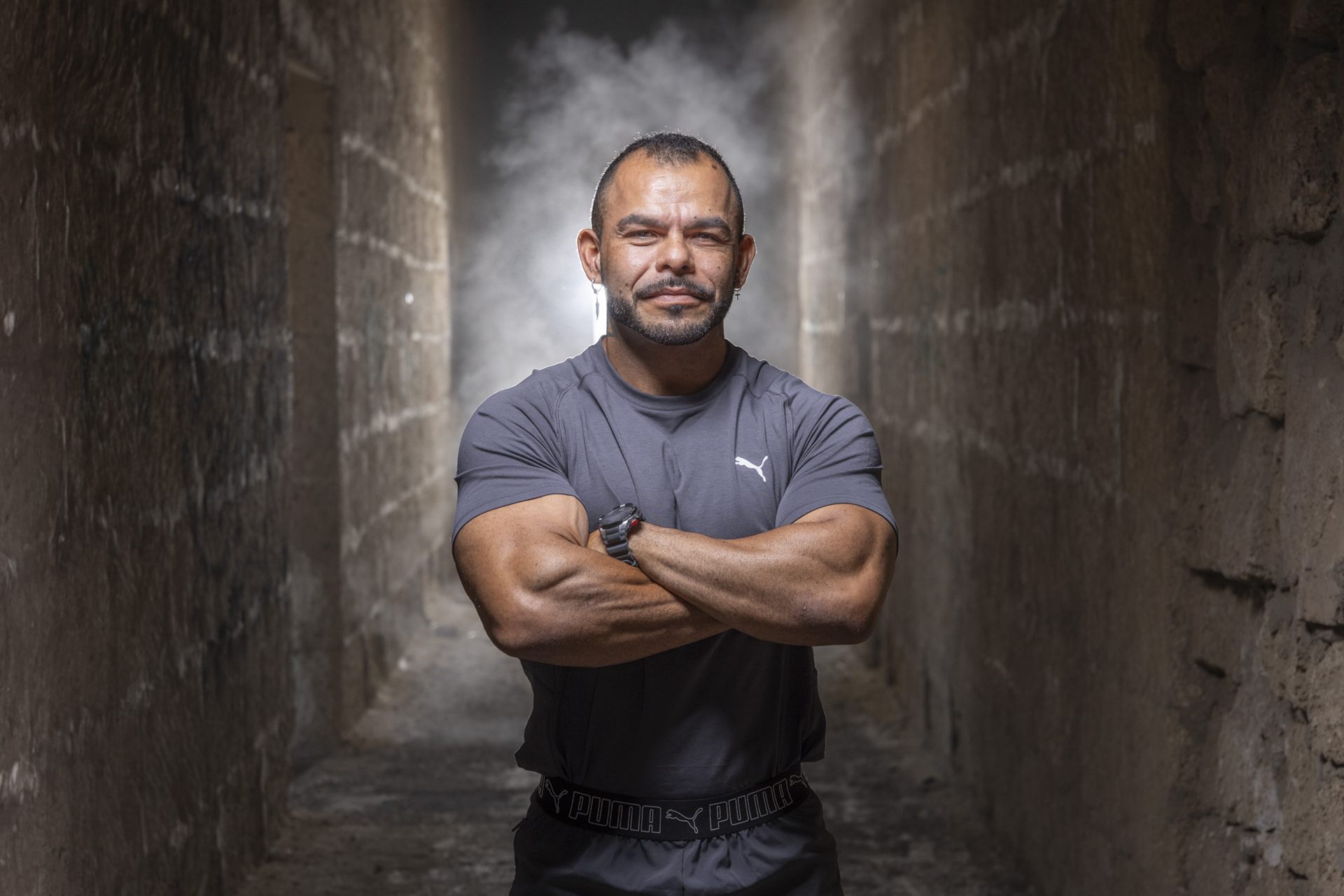Cinematic portrait of a bodybuilder near the Abades lepra colony