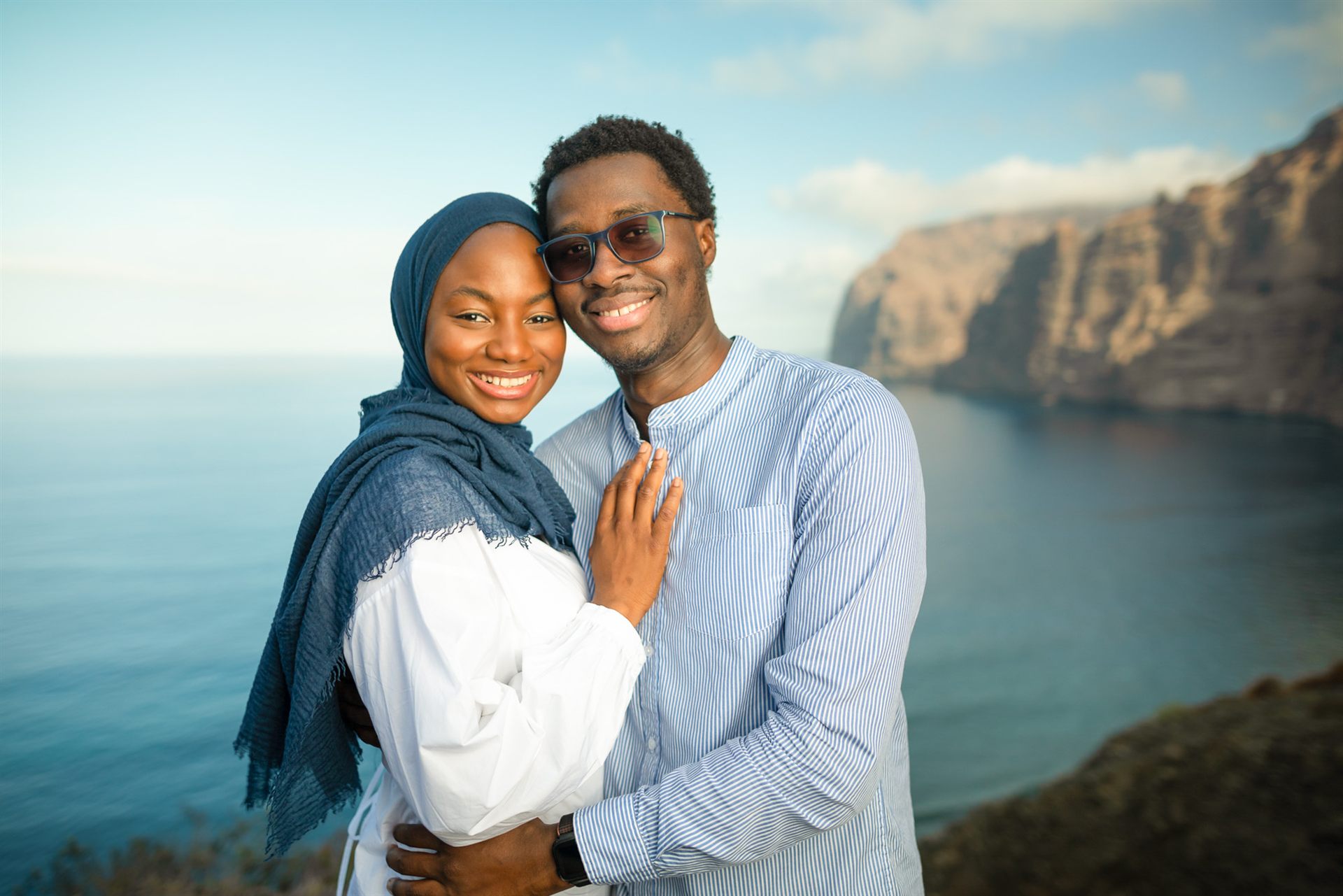 Couple portrait with the Los Gigantes cliffs in the background